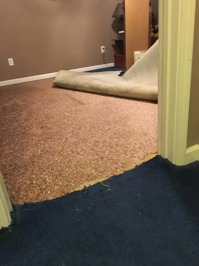 Carpet pad removal revealing water damage during Drying & Dehumidification in Omak